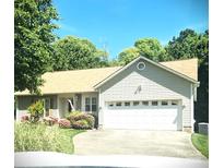 Charming ranch-style home with a two-car garage, lovely landscaping, and a welcoming curb appeal at 317 Robert Keever Rd, Stanley, NC 28164