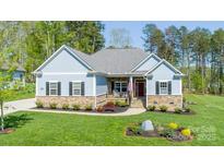Charming single-story home featuring stone accents and a beautifully landscaped front yard at 4594 N Wynswept Dr, Maiden, NC 28650