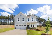 Charming two-story home with a two car garage, manicured lawn and lovely landscaping at 9913 Jack Nicklaus Dr # 908, Lancaster, SC 29720