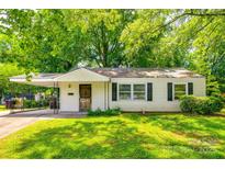 Charming single-story home featuring a covered carport and a well-maintained front lawn with mature trees at 1430 Bose Ave, Rock Hill, SC 29732