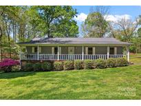 Charming single story home featuring a lovely front porch, well-manicured lawn and tasteful landscaping at 531 Hattaway Dr, Mount Gilead, NC 27306