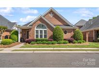 Charming brick home with manicured landscaping, decorative windows, and inviting curb appeal at 962 Blakeley Walk, Rock Hill, SC 29732