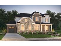 Charming two-story home showcasing a blend of stone and brick, complemented by a well-manicured lawn and inviting curb appeal at 14105 White Gardens Ln # 5, Huntersville, NC 28078