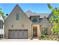 Charming home with a two car garage, brick accents, and a well manicured lawn at 3473 Willow Oak Rd, Charlotte, NC 28209