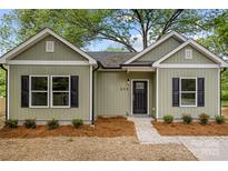 Charming single-story home with light green siding, black shutters and a welcoming front entrance at 508 Clegg St, Shelby, NC 28150