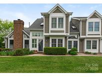 Charming two-story home with manicured lawn and inviting curb appeal at 8251 Tradd Ct, Charlotte, NC 28210