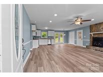 Open-concept living room features a stone fireplace and ample natural light at 1195 Ralph B Keener Rd, Lincolnton, NC 28092