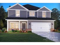 Charming two-story home showcasing a well-manicured lawn and an attached two-car garage, perfect for Gathering living at 1222 Morehead Dr, Salisbury, NC 28144