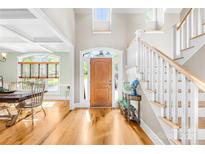 Bright foyer featuring hardwood floors, staircase, and natural light, offering a welcoming entrance at 401 Yorkfield Dr, Shelby, NC 28150