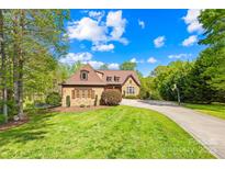 Charming home with a well-manicured lawn, beautiful landscaping, and a long driveway at 401 Yorkfield Dr, Shelby, NC 28150