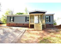 Charming single story home featuring a welcoming porch and a classic color scheme at 828 Long Bow Rd, Salisbury, NC 28144