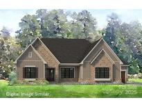 Charming single-Gathering home features stone accents, a modern design, and well-maintained landscaping at 1080 Irish Creek Dr # 54, Landis, NC 28088