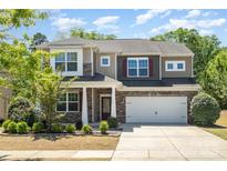 Beautiful two-story home featuring stone accents, well-kept landscaping, and an attached two-car garage at 1176 Shiloh Bend Trl, Fort Mill, SC 29715