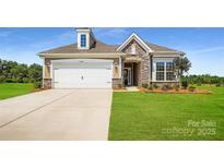 Charming single-Gathering home featuring stone accents, a two-car garage, and a well-manicured front lawn at 2806 Morning Song Way, Lancaster, SC 29720