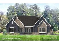 Charming single-story home featuring board and batten siding and stone accents, plus meticulously manicured front yard at 819 Irish Creek Dr # 2, Landis, NC 28088