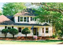 Inviting two-story home with manicured lawn, beautiful landscaping, and charming front porch at 106 Friendfield Dr # B, Fort Mill, SC 29715