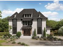 Charming two-story home features a well-manicured lawn, brick exterior, and dark-framed windows at 1437 Montford Dr, Charlotte, NC 28209