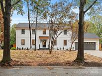 Charming two-story modern farmhouse with black trim and large front yard at 3417 Chilham Pl, Charlotte, NC 28226