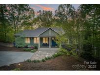 Charming craftsman home featuring a landscaped front yard with stone path and a welcoming front porch at 8086 Summit Ridge Dr, Catawba, NC 28609