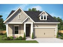 Charming home featuring neutral siding, gabled roof, attached garage and professionally landscaped yard at 1334 Idyllic Ln, Waxhaw, NC 28173