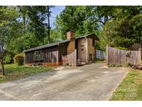 Charming home featuring a brick facade, wood siding and a well-manicured lawn at 846 Gist Rd, Rock Hill, SC 29732
