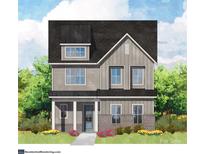 Charming two-story home with gray siding, complemented by professionally landscaped yard at 19044 Newburg Hill Rd, Davidson, NC 28036
