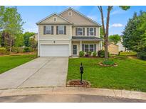 Inviting two-story home with a well-maintained lawn and attached two-car garage at 2624 St Helena Ct, Fort Mill, SC 29715