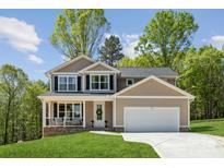 Beautiful two-story home with a front porch and well-maintained lawn at 1112 Allman Ext, Mount Pleasant, NC 28124