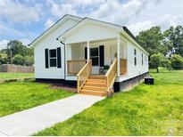 Charming single-story home with a welcoming front porch and well-maintained lawn at 159 Hallman St, Cherryville, NC 28021