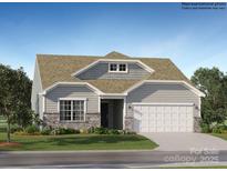 Charming single-story home showcasing a stone-accented facade, light gray siding, and a spacious two-car garage at 1613 Spring Lot Dr, Edgemoor, SC 29712