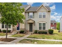 Charming townhome with a welcoming front yard and an American flag displayed at 1720 Fleetwood Dr, Charlotte, NC 28208
