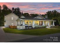 Charming home exterior with a spacious front porch, stone accents, and manicured lawn at 3008 Gantt St, Salisbury, NC 28146