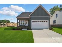 Charming single-story home with a two-car garage and well-manicured lawn at 424 Fulton Dr, Kings Mountain, NC 28086