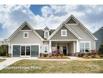 Inviting new construction home with beautiful lawn and craftsman-style details at 5006 Mclaughlin Dr # 103, Waxhaw, NC 28173