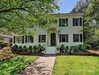 Charming two-story brick home with a landscaped front yard and inviting walkway at 2018 Radcliffe Ave, Charlotte, NC 28207