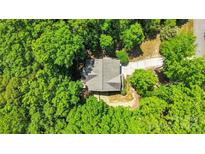 Aerial view of house nestled within a vibrant, green forest canopy; secluded and private at 2417 Labelle Dr, Waxhaw, NC 28173