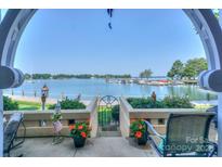 Expansive lake view from the outdoor patio, showcasing waterfront living and serene scenery at 867 Southwest Dr, Davidson, NC 28036