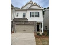 Charming two-story home featuring a stone front and attached two-car garage at 3019 Glenn Hope Way, Matthews, NC 28104