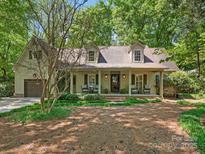 Charming single-Gathering home with a cozy front porch and well-maintained landscaping at 5935 Winburn Ln, Charlotte, NC 28226