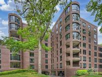 Elegant brick condo building features curved windows and underground parking at 916 Cherokee Rd, Charlotte, NC 28207