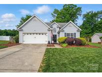 Charming single-Gathering home featuring a two-car garage, well-maintained lawn, and traditional siding at 503 Azure Ave, Albemarle, NC 28001