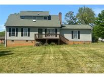 Charming home with a deck and a spacious backyard, perfect for outdoor entertaining at 109 Terrace Pl, Lincolnton, NC 28092