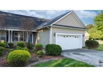 Exterior of a charming house featuring a two-car garage and well-manicured landscaping at 1618 33Rd Ne Ave # 1, Hickory, NC 28601