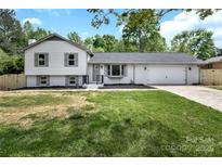 Charming two-story home features a large yard, attached garage and neutral colors at 205 Mcgregor Rd, Gastonia, NC 28056