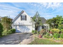 Charming home featuring a well-manicured lawn and a classic two-car garage and mature landscaping at 2110 Cool Springs Ct, Kannapolis, NC 28083