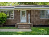 Close-up of the home's front entrance, featuring a brick facade and a welcoming front porch at 438 Starcrest Cir # C, Rock Hill, SC 29730
