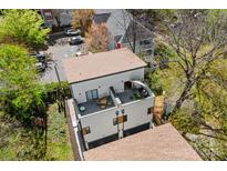 A modern home featuring a private rooftop deck with stylish outdoor seating, perfect for relaxation and entertainment at 1115 Greenleaf Ave # B, Charlotte, NC 28202