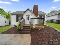 Charming single-story home featuring a cozy front porch and freshly landscaped yard at 268 Jefferson Ne Ct, Concord, NC 28025