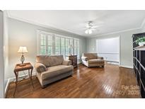 Cozy living room with hardwood floors, natural light, and neutral-toned seating creating a welcoming atmosphere at 3378 Tanglewood Dr, Rock Hill, SC 29732
