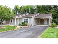 Charming single story home with neutral siding, a carport, and a well-maintained yard at 505 2Nd Street Ne Pl # C4, Conover, NC 28613